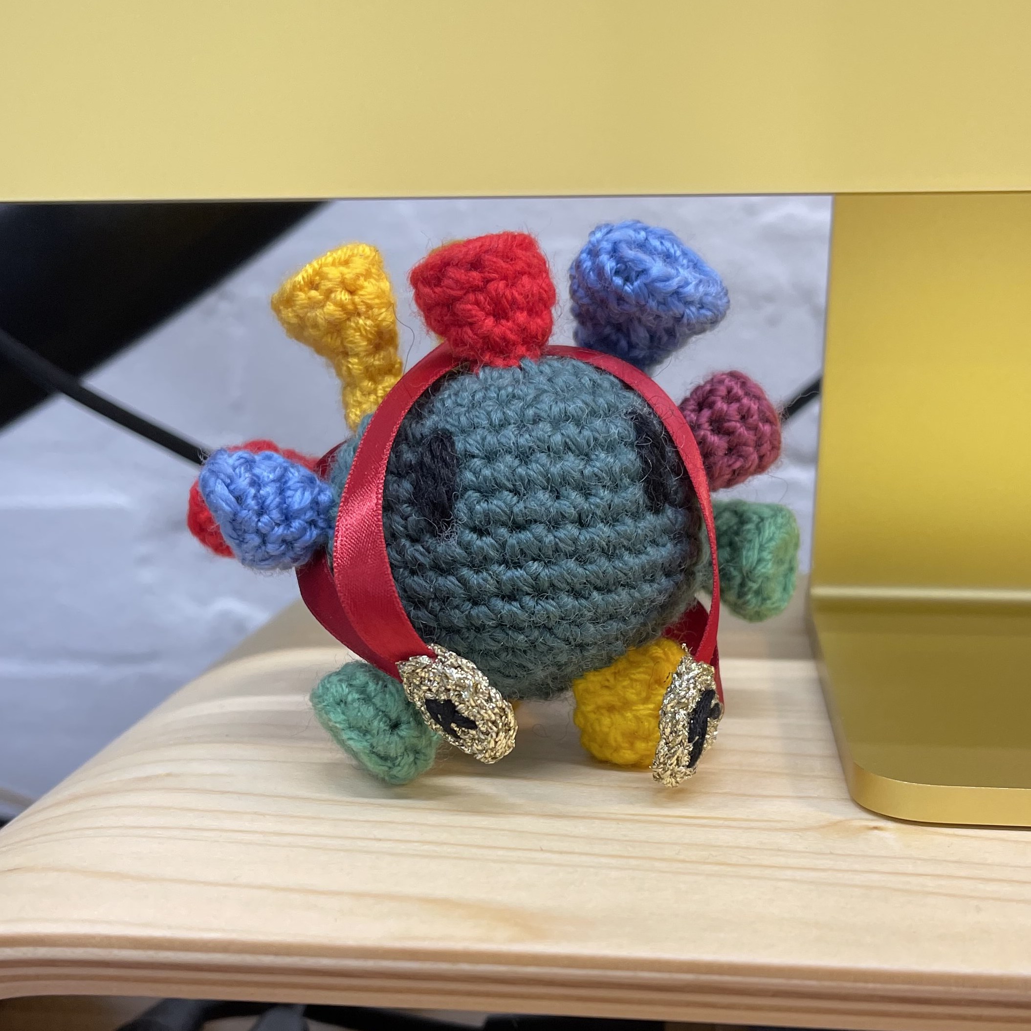 Myke’s Ricky below his yellow iMac